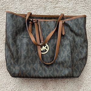 Brown/tan colored Michael Kors everyday tote bag